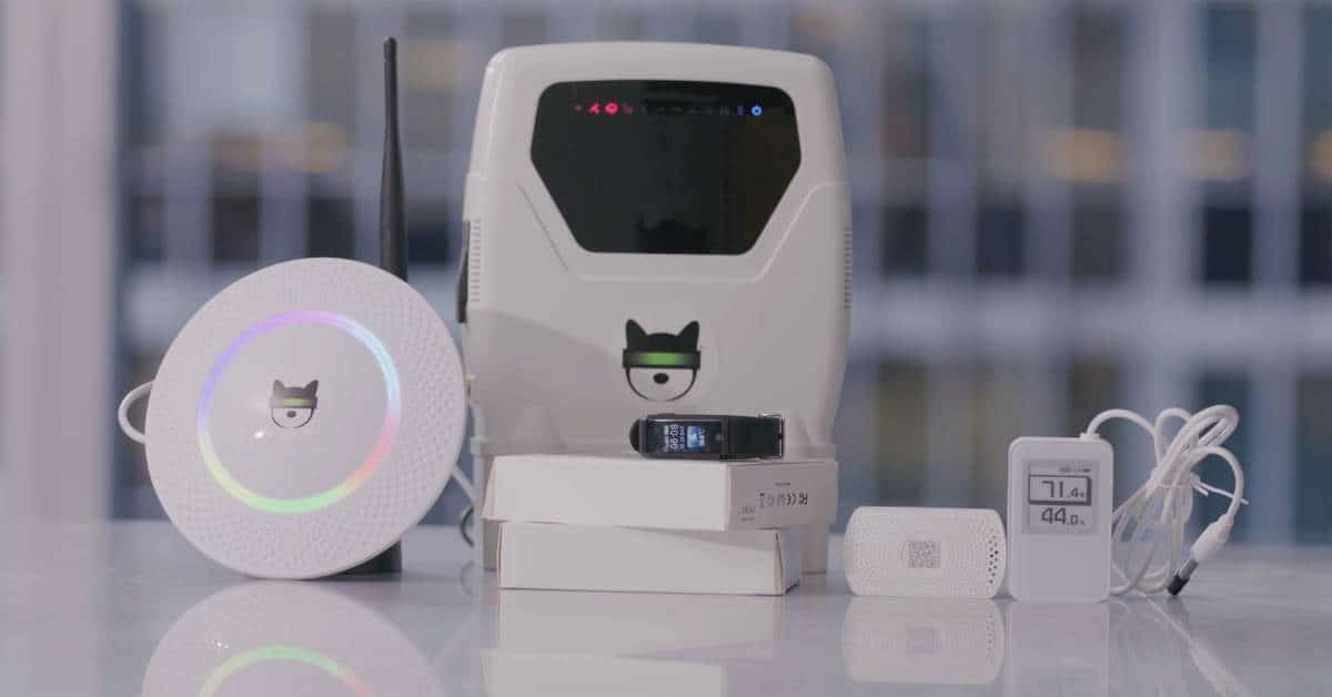 Stunning product shot of a collection of our technology offerings, the BUKI Box and the BUKI Hub, temp sensor, movement sensor and wearable, lots of amazing technology to make the world a safer healthier place